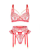 A red and white lingerie set featuring a bralette with floral lace applique, a matching garter belt with attached thong, and red suspender straps with gold-toned tips, displayed on a solid white background.